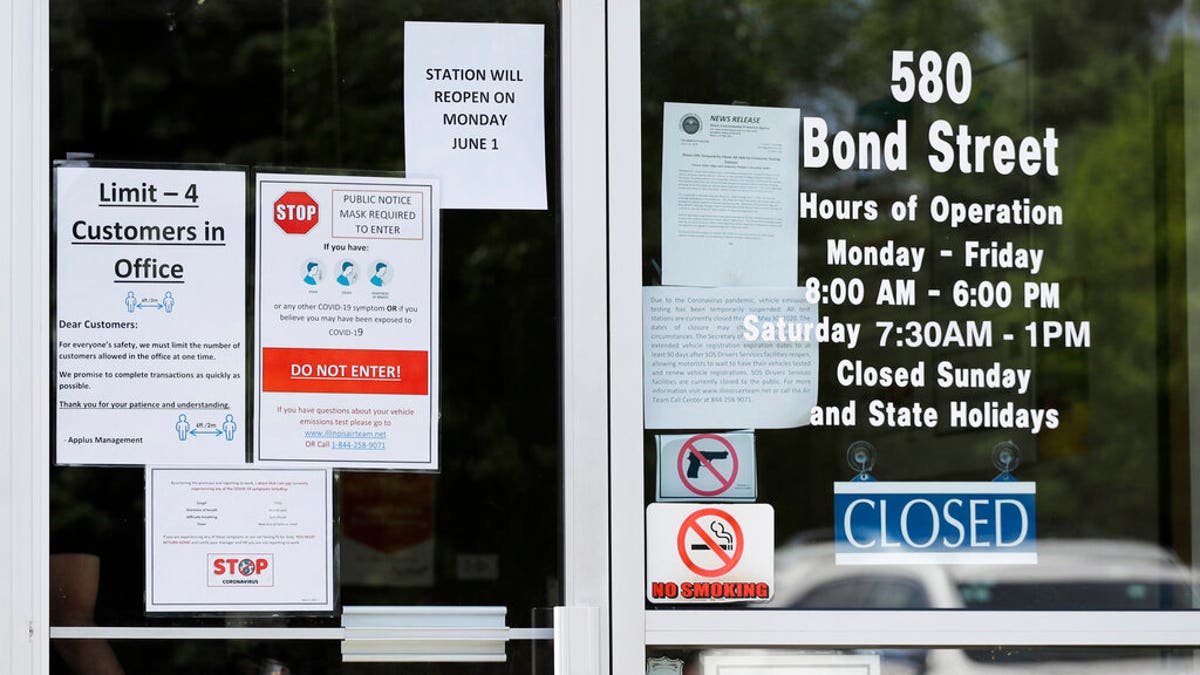 Information signs are displayed at an Illinois Air Team Test Station in Lincolnshire, Ill., Wednesday, May 27, 2020. 