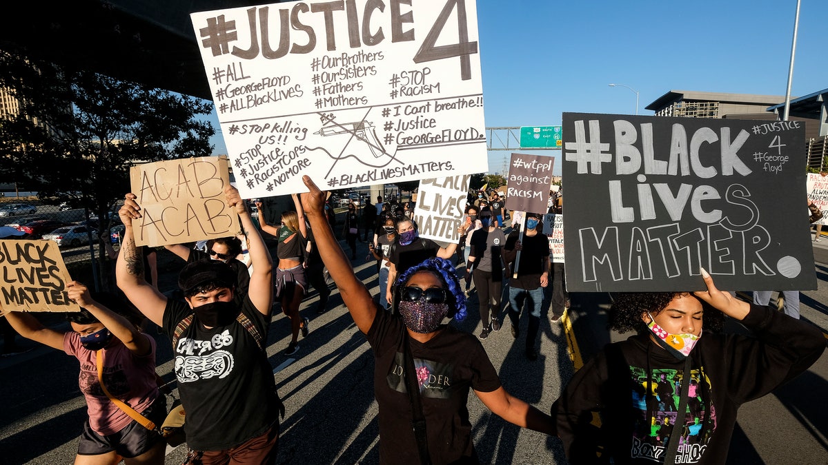 Demonstrators shut down the Hollywood Freeway in Los Angeles on Wednesday, May 27, 2020, during a protest about the death of George Floyd in police custody in Minneapolis earlier in the week. (AP Photo/Ringo H.W. Chiu)