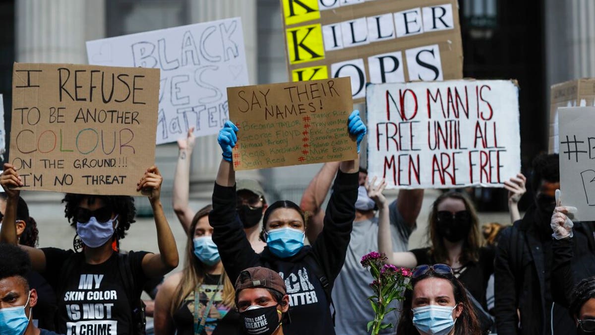 Protesters rally over the death of George Floyd, a black man who was in police custody in Minneapolis Friday, May 29, 2020, in New York. Floyd died after being restrained by Minneapolis police officers on Memorial Day. 