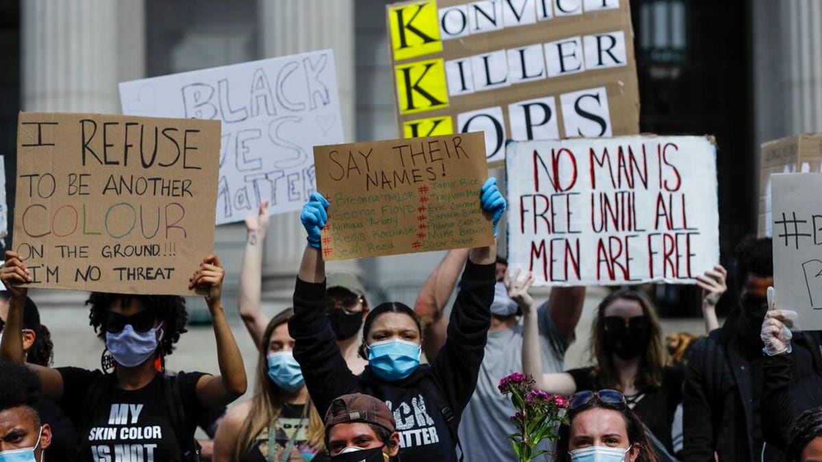 Protesters rally over the death of George Floyd, a black man who was in police custody in Minneapolis Friday, May 29, 2020, in New York. Floyd died after being restrained by Minneapolis police officers on Memorial Day.