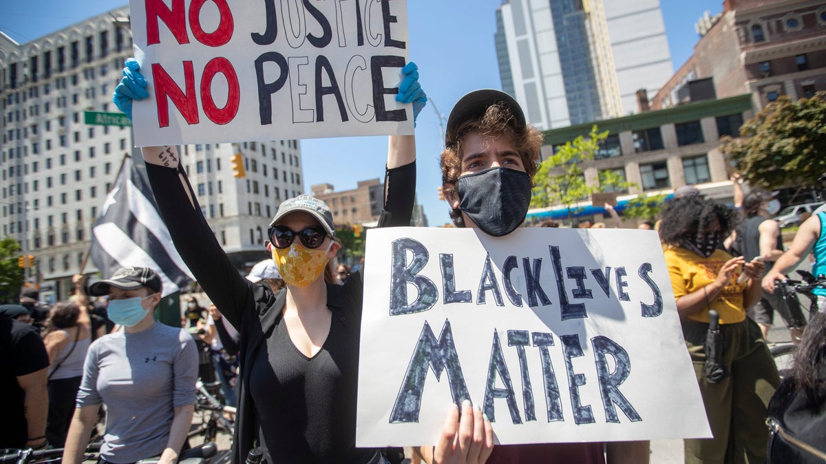 Demonstrators participate in a solidarity rally for George Floyd, Saturday, May 30, 2020, in the Harlem neighborhood of New York. Floyd died after Minneapolis police officer Derek Chauvin pressed his knee into his neck for several minutes even after he stopped moving and pleading for air. (AP Photo/Mary Altaffer)