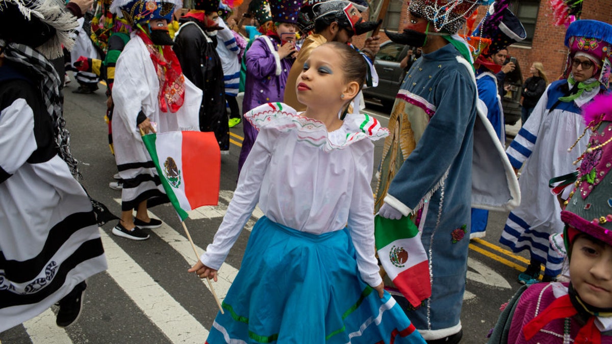 A young girl is seen participating in a Cinco de Mayo parade in New York City in 2018.