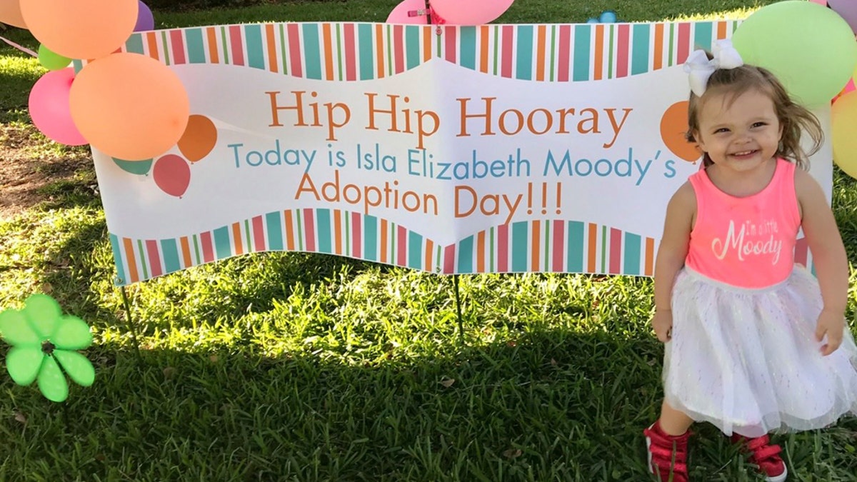 Isla Moody on her adoption day, pictured.