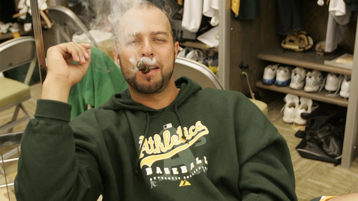 OAKLAND, CA - APRIL 14: Esteban Loaiza of the Oakland Athletics smokes a cigar in the clubhouse before the game against the New York Yankees at the McAfee Coliseum in Oakland, California on April 14, 2007. (Photo by Michael Zagaris/MLB Photos via Getty Images)