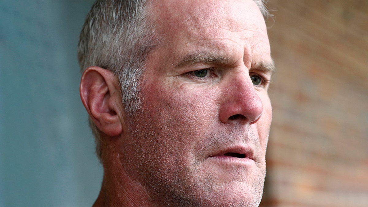 FILE - In this Oct. 17, 2018, file photo, former NFL quarterback Brett Favre speaks with reporters in Jackson, Miss., about his support for Willowood Developmental Center, a facility that provides training and assistance for special needs students, The Mississippi state auditor said Wednesday, May 6, 2020, that Favre is repaying $1.1 million he received for multiple speaking engagements where auditor’s staffers said Favre did not show up. (AP Photo/Rogelio V. Solis, File)