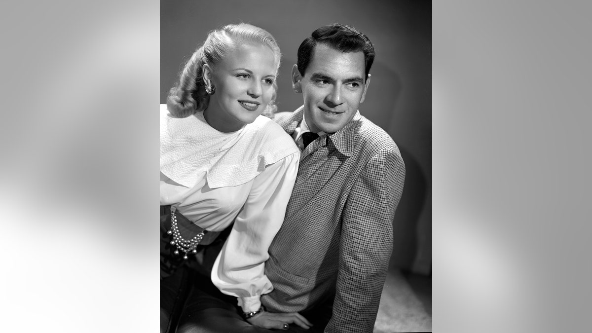 From left: Singer-songwriter Peggy Lee and orchestra leader Dave Barbour for CBS Radio's 'The Electric Hour Summer Series' music program. Hollywood, CA. Image dated May 1, 1947.