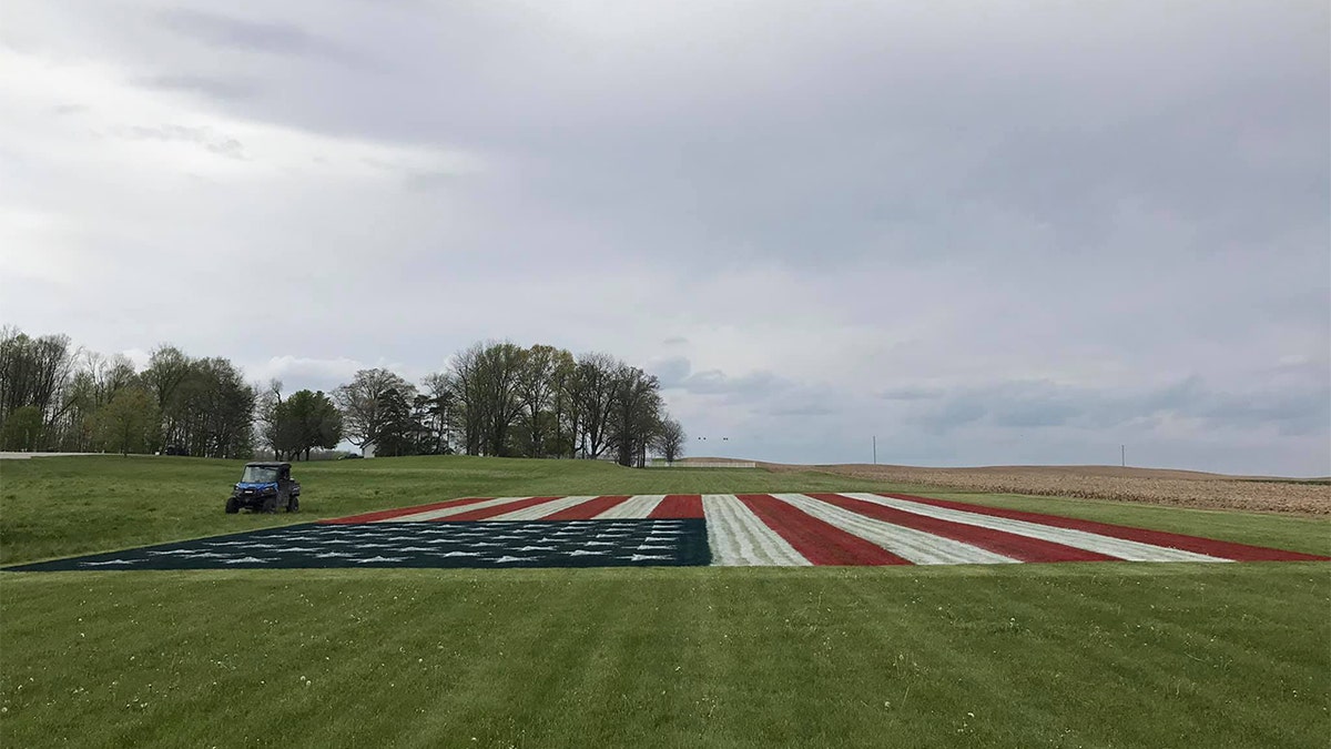 Justin Riggins' massive American flag painting on his property in Indiana. (Credit: Justin Riggins)