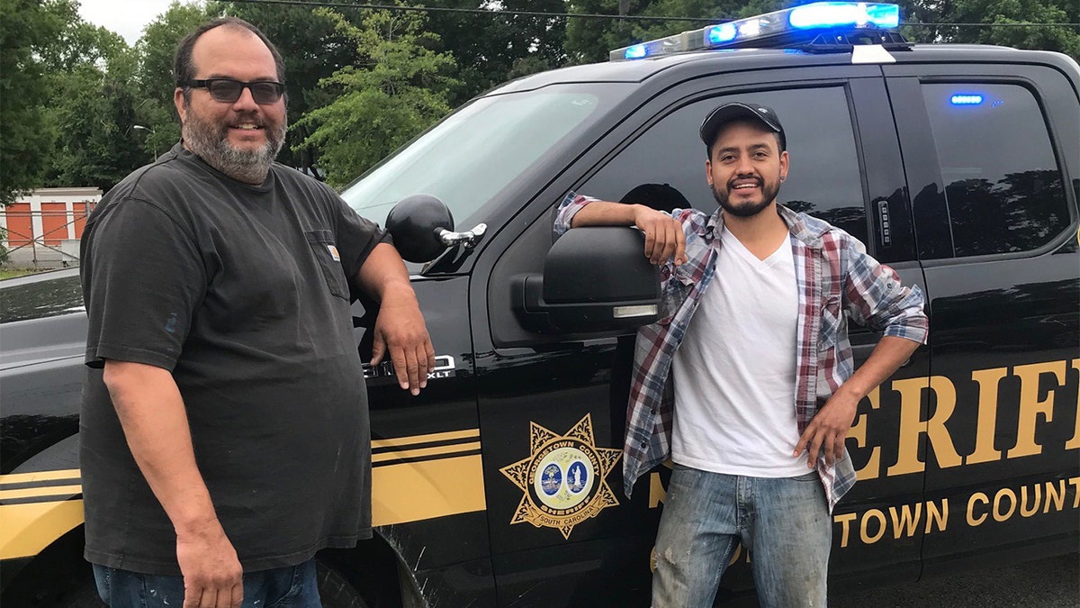 To thank the duo, the sheriff’s office proclaimed them “honest men” and posted a picture of them smiling alongside a patrol vehicle. (Courtesy: Georgetown County Sheriff's Office)