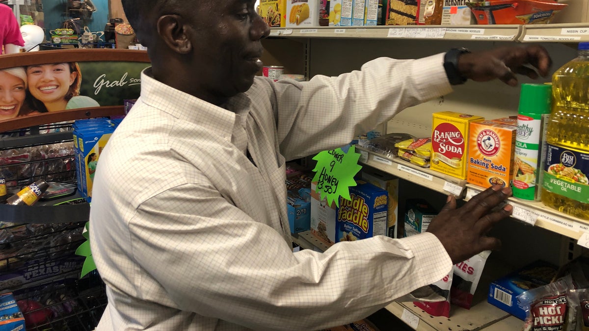 Burnell Cotlon stocks shelves in 'Burnell's Lower 9th Ward Market.' He's had to give away food to people in the community who are struggling to make it through the coronavirus pandemic. (Fox News/Charles Watson)