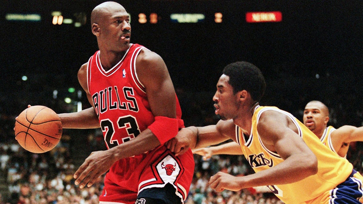 Michael Jordan guarded by Kobe Bryant