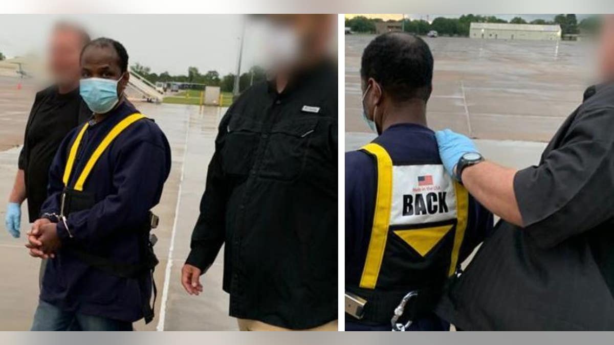 Alexander Mentol Zinnah arriving in Liberia while escorted by ERO officers.
