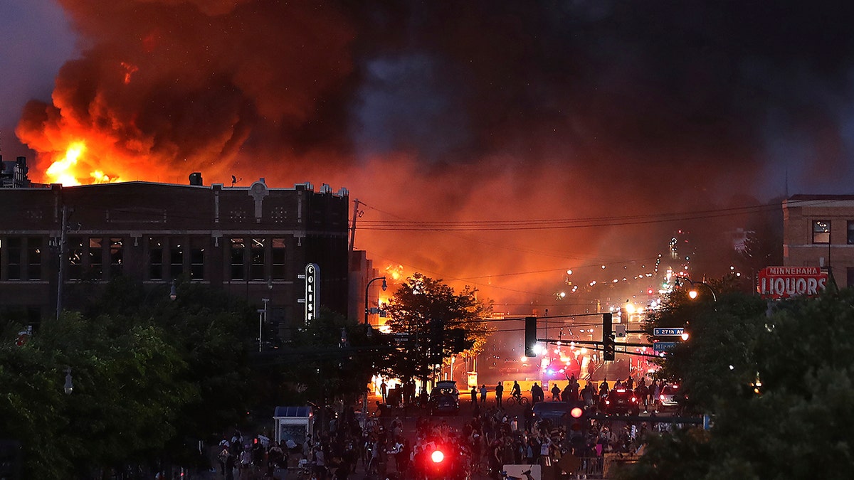 Seen from Hiawatha Avenue, a large fire burns Thursday, May 28, 2020. (David Joles/Star Tribune via AP)