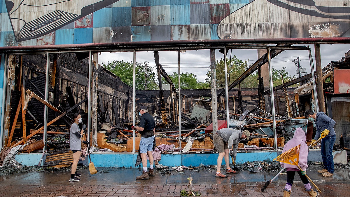 Hundreds of volunteers showed up to clean along University Avenue on Friday, May 29, 2020, in St. Paul, Minn. (Elizabeth Flores/Star Tribune via AP)