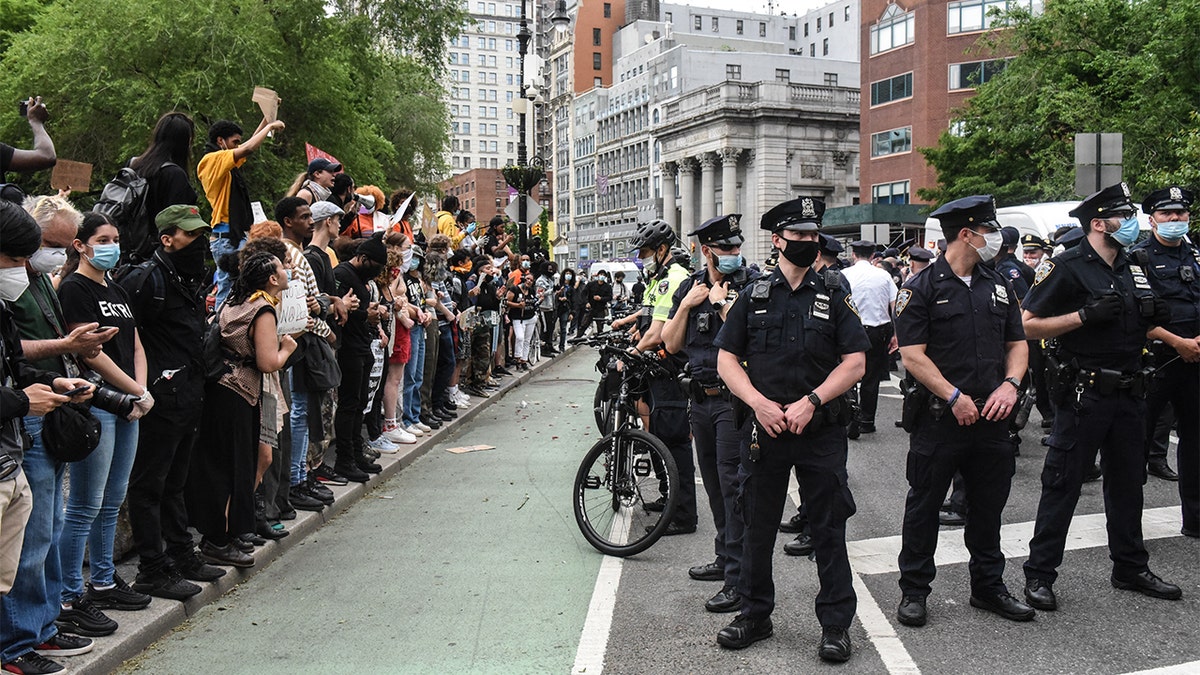 Protesters shouting at police during a rally against the death of George Floyd in New York City. (Stephanie Keith/Getty Images)