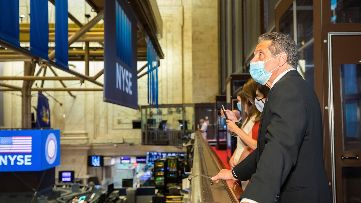 New York State Gov. Andrew Cuomo looks over the floor of the New York Stock Exchange on Tuesday. (New York Stock Exchange/AP)