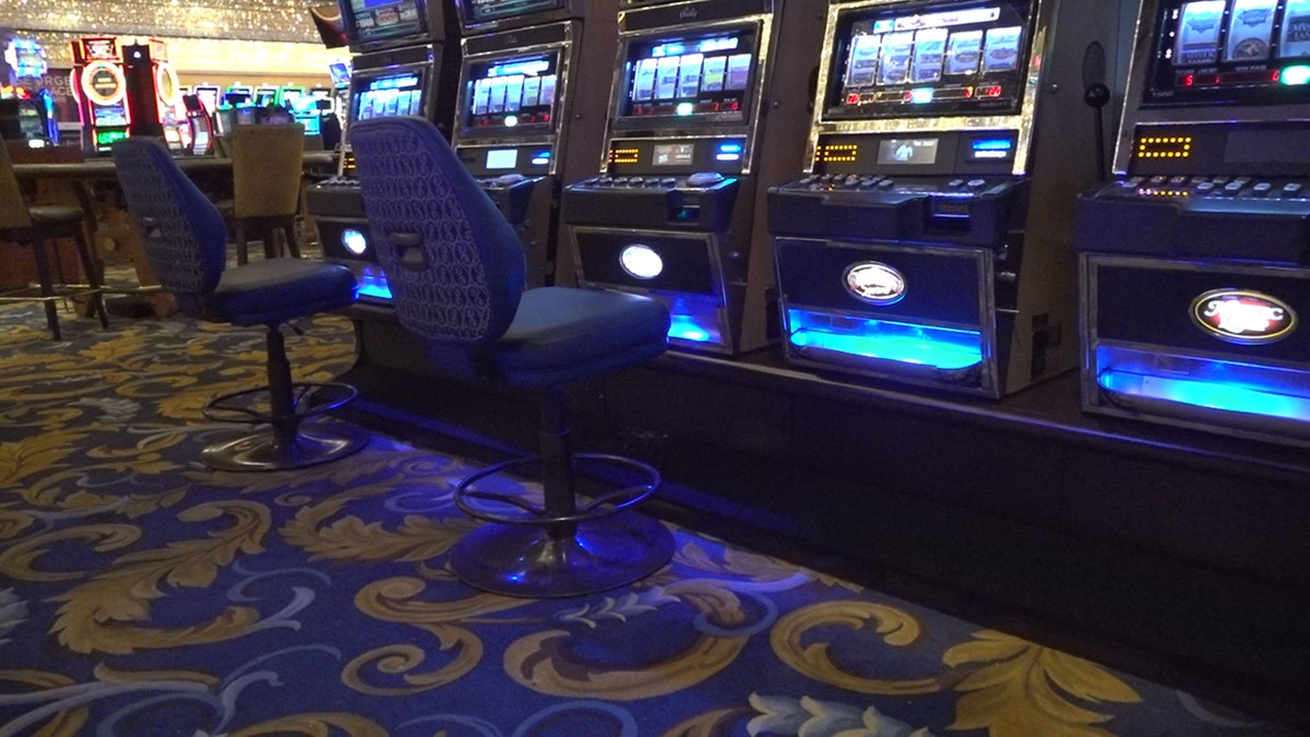 Chairs have been removed at slot machines and gaming tables to comply with social distancing protocols.