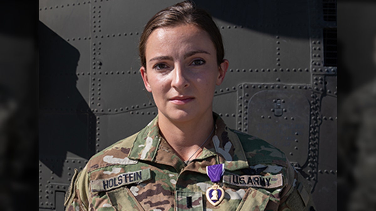 1st Lt. Abigail Holstein was presented the Purple Heart on May 3, 2020, for her injuries sustained during the theater ballistic missile attacks at Al Asad Air Base, Iraq, on January 8, 2020. Of the 27 Soldiers to receive Purple Hearts from the January attacks, 1st Lt. Holstein is one of the few 34th Expeditionary Combat Aviation Brigade recipients to return to duty after receiving initial treatment for her injuries and thus, received the Purple Heart medal in-theater. She serves as an enroute critical care nurse with Charlie Company, 3-238th General Support Aviation Battalion. (U.S. Army photo by Sgt. Sydney Mariette)