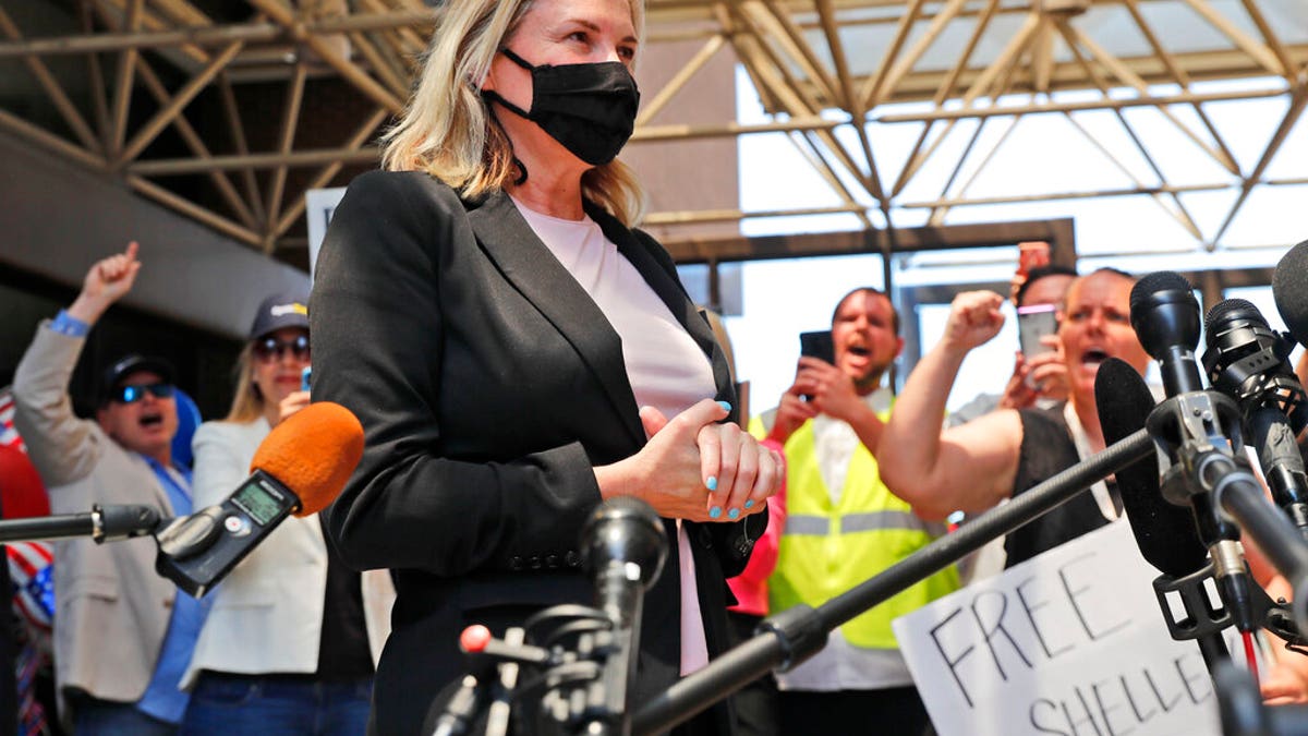 Salon owner Shelley Luther begins to speak to the media after she was released from jail in Dallas, Thursday, May 7, 2020. (AP Photo/LM Otero)