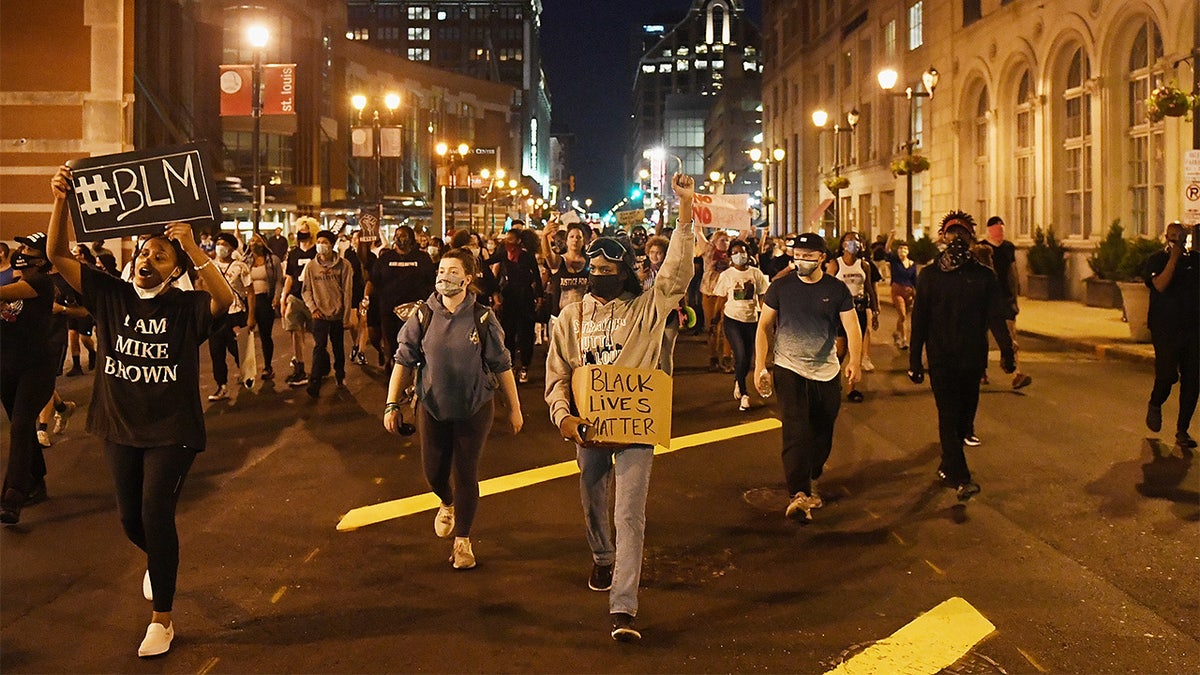 Protesters rally as they march through the streets on May 29 in St Louis, Missouri.