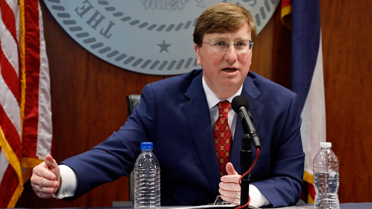 Gov. Tate Reeves speaks about selecting Burl Cain, the former warden of the Louisiana State Penitentiary, commonly known as Angola, as the new commissioner of the Mississippi Department of Correction, during Reeves' daily coronavirus update for media in Jackson, Miss., Wednesday, May 20, 2020.