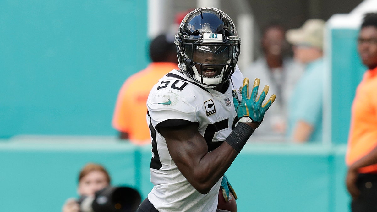 Dec. 23, 2018: Jacksonville Jaguars outside linebacker Telvin Smith (50) runs for a touchdown after intercepting a pass, during the second half at an NFL football game against the Miami Dolphins in Miami Gardens, Fla. (AP Photo/Brynn Anderson)
