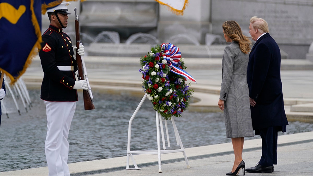 President Donald Trump and first lady Melania Trump participate in a wreath-laying ceremony at the World War II Memorial in Washington, D.C., to commemorate the 75th anniversary of Victory in Europe Day on May 8, 2020.