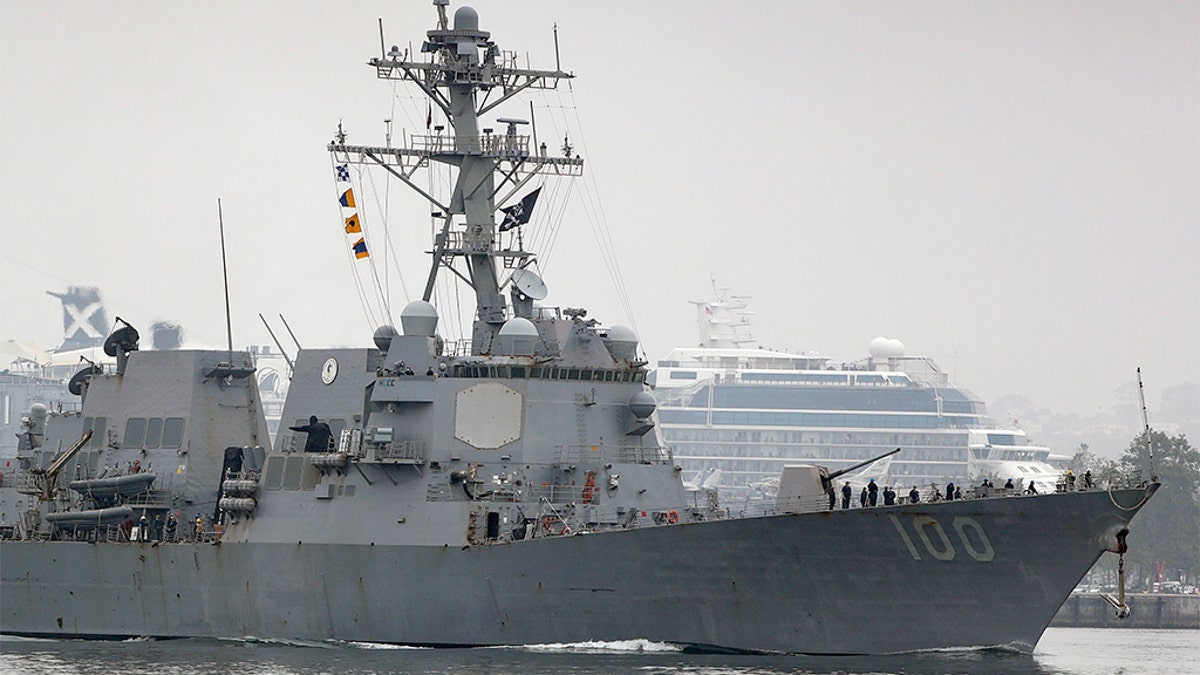 The USS Kidd flies its traditional skull and crossbones flag while passing downtown San Diego as it returns to Naval Base San Diego, Tuesday, April 28, 2020, as seen from Coronado, Calif. - file photo.