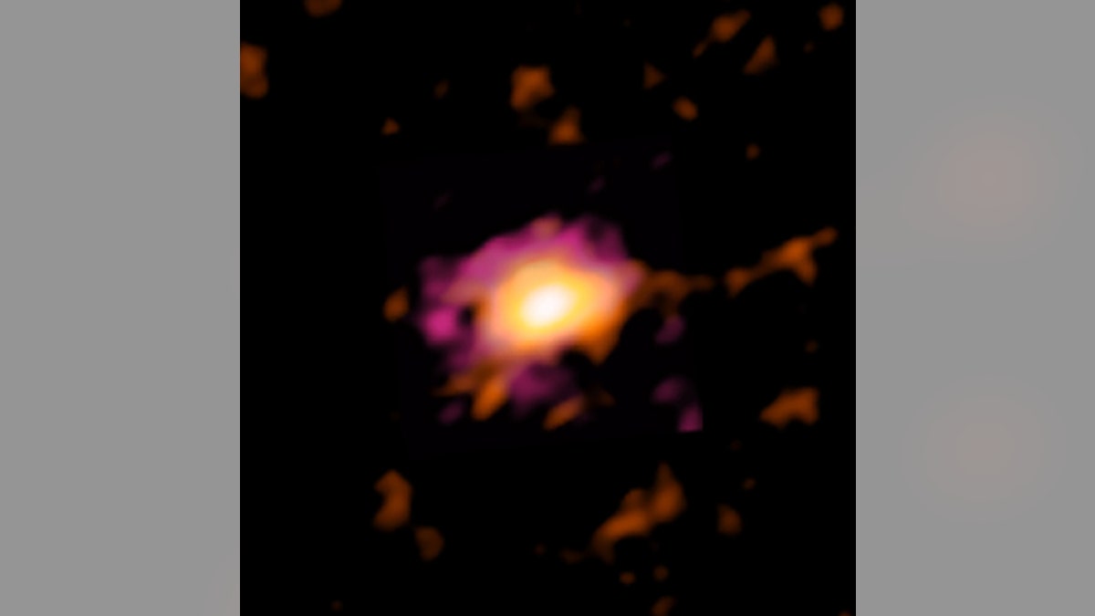 ALMA radio image of the Wolfe Disk, seen when the universe was only ten percent of its current age. (Credit: ALMA [ESO/NAOJ/NRAO], M. Neeleman; NRAO/AUI/NSF, S. Dagnello)