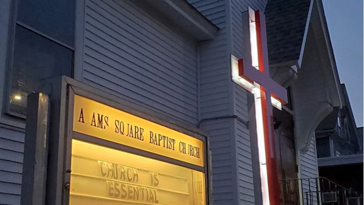 The Adams Square Baptist Church in Worcester, Mass., has a sign that says, "Church is essential," as state city officials issue fines and threat of jail time to the pastor.