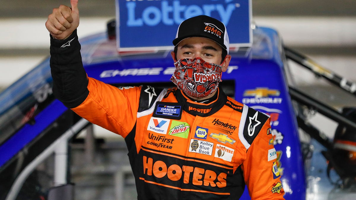 Chase Elliott celebrates after winning the NASCAR Truck Series auto race at Charlotte Motor Speedway Tuesday, May 26, 2020, in Concord, N.C. (Associated Press)