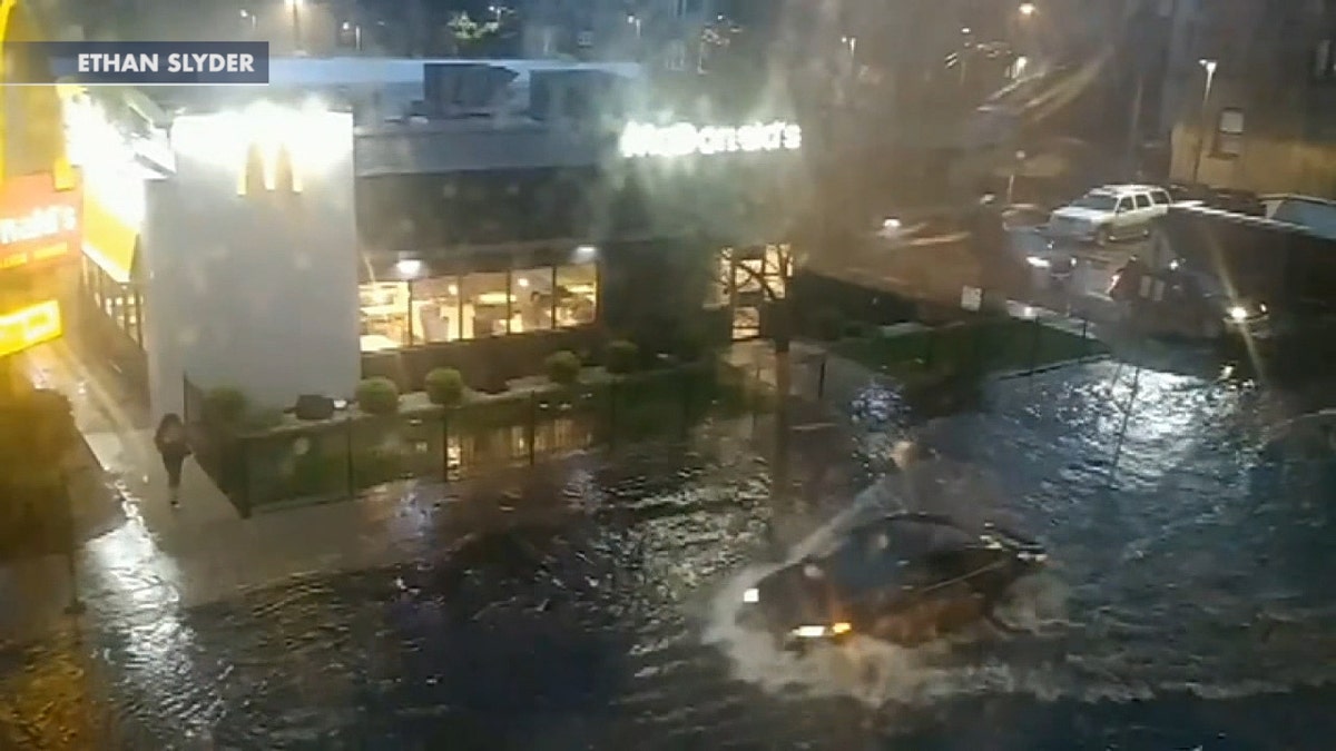 Cars were seen driving through floodwaters after thunderstorms left many parts of the Chicago area inundated with water on May 17, 2020.