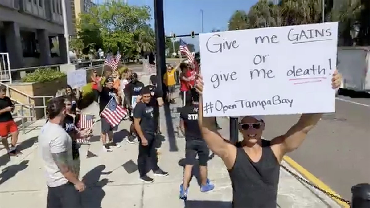 People protest for re-opening the economy at a faster rate outside the Old Pinellas County Courthouse, amid the coronavirus crisis, in Clearwater, Florida, U.S. May 11, 2020 in this still image taken from a social media video. (JOZEF GHERMAN/ FACEBOOK/ OPEN TAMPA BAY/via REUTERS)
