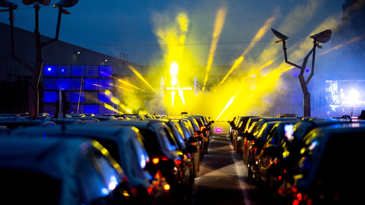 April 30, 2020, Lower Saxony, Schuttorf: Guests park their cars during a car disco in the parking lot of the disco "Index". This large-capacity discotheque in Grafschaft Bentheim is offering a car disco for the second time. In 250 cars a total of 500 guests can participate. Photo: Hauke-Christian Dittrich/dpa (Photo by Hauke-Christian Dittrich/picture alliance via Getty Images)