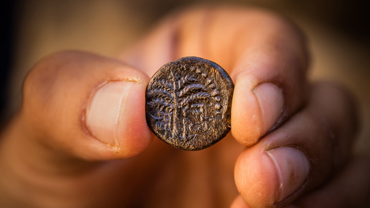 Bar Kokhba revolt coin inscribed with the word "Jerusalem" and a picture of a date palm.