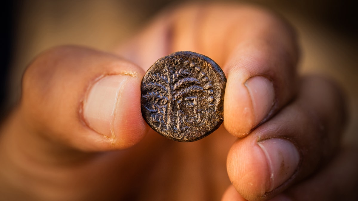 Bar Kokhba revolt coin inscribed with the word "Jerusalem" and a picture of a date palm.