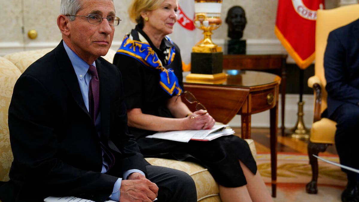 Director of the National Institute of Allergy and Infectious Diseases Dr. Anthony Fauci, left, and White House coronavirus response coordinator Dr. Deborah Birx, attend a meeting about the coronavirus with Louisiana Gov. John Bel Edwards and President Donald Trump in the Oval Office of the White House, Wednesday, April 29, 2020, in Washington. (AP Photo/Evan Vucci)