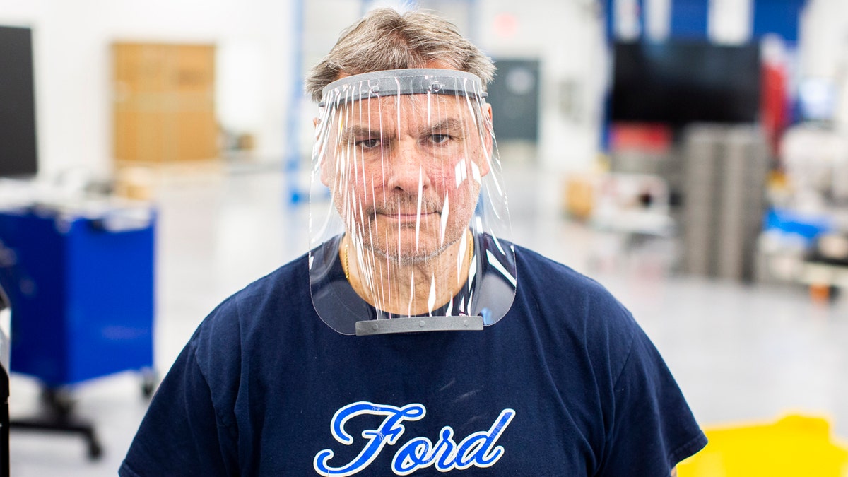 Mar. 24, 2020 – Dave Jacek, 3D printing technical, wears a prototype of a 3D-printed medical face shield printed at Ford’s Advanced Manufacturing Center. Ford Motor Company, joining forces with firms including 3M and GE Healthcare, is lending its manufacturing and engineering expertise to quickly expand production of urgently needed medical equipment and supplies for healthcare workers, first responders and patients fighting coronavirus. (Ford Motor Co. photo)