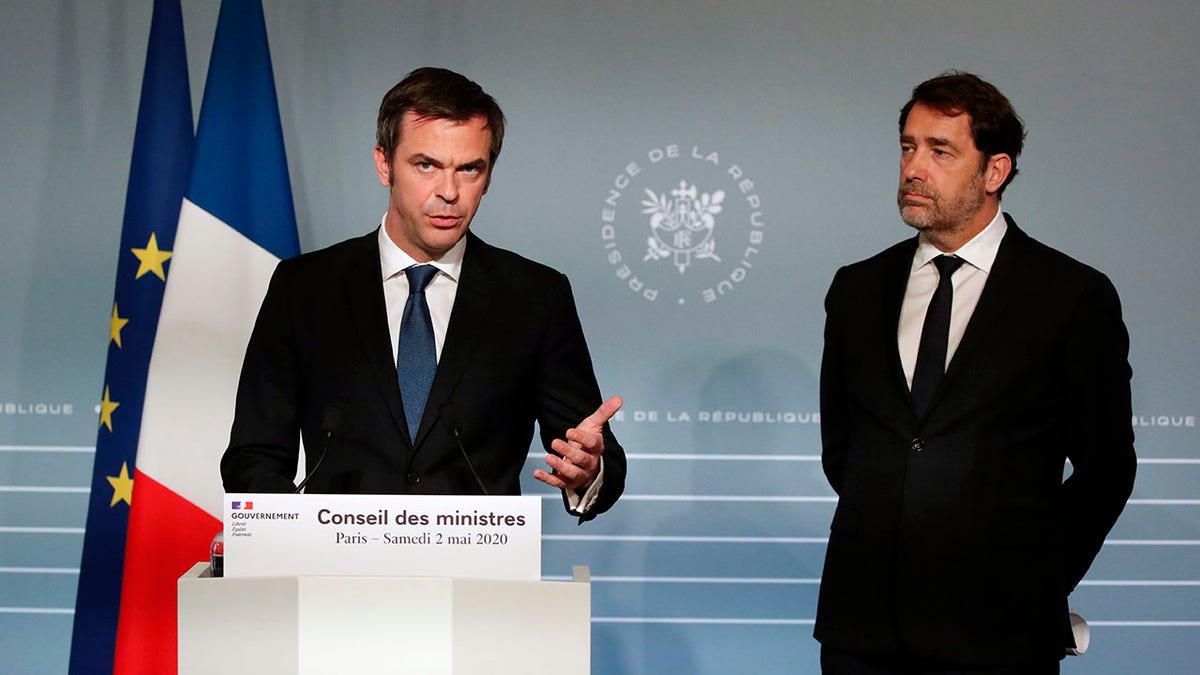 French Minister for Solidarity and Health Olivier Veran, left, and French Interior Minister Christophe Castaner attend a press conference in Paris on Saturday as nationwide confinement to counter the COVID-19 virus continues until May 11 . (AP Photo/Francois Mori, pool)