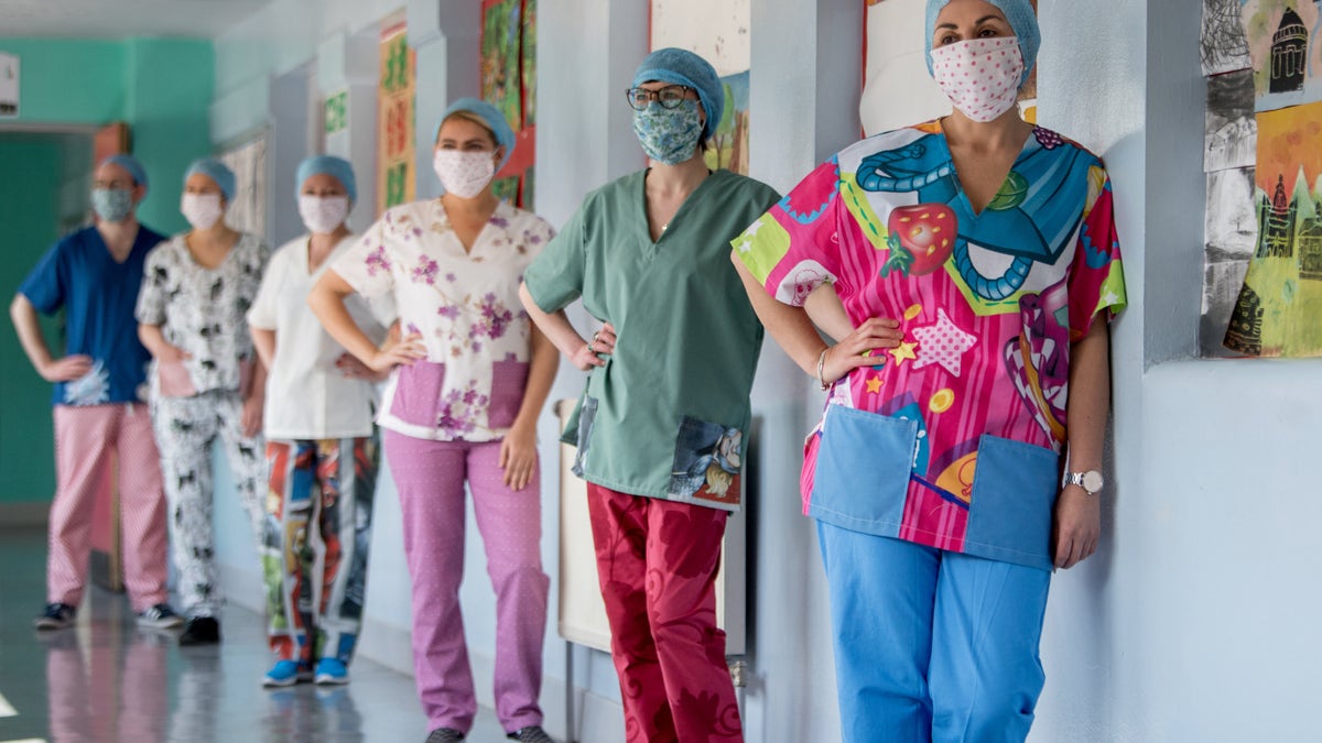 Nurses at Glasgow Royal Infirmary get their hands on a set of wacky scrubs made by volunteers.