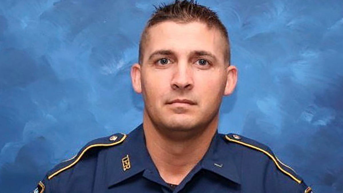 Trooper George Baker, 33, died Sunday, days after he was struck by another law enforcement vehicle as he aided in a pursuit of two suspects. (Louisiana State Police via AP)
