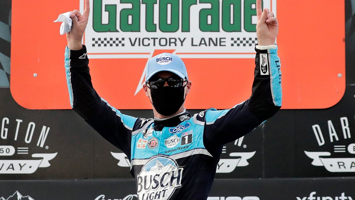 Harvick donned a facemask on the winner's podium in keeping with the health and safety protocols in place at the track.