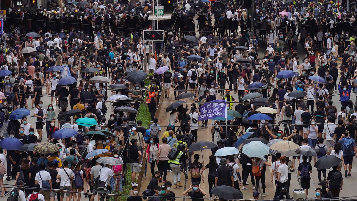 Pro-democracy protesters march during a protest against Beijing's national security legislation in Hong Kong, Sunday, May 24, 2020. (AP Photo/Vincent Yu)