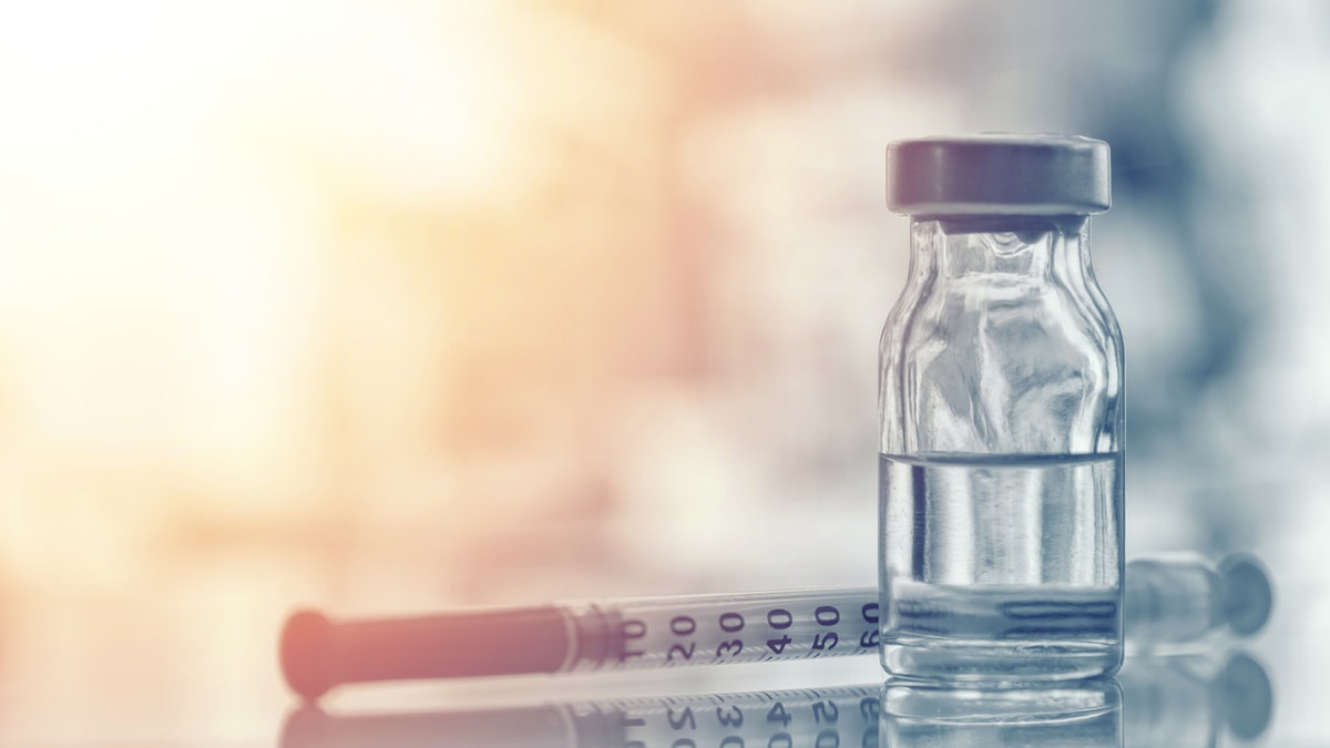 istock image of medical vial and syringe