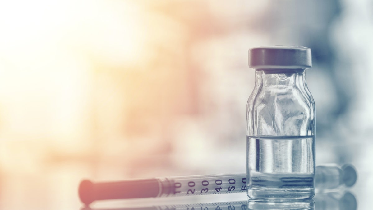 istock image of medical vial and syringe