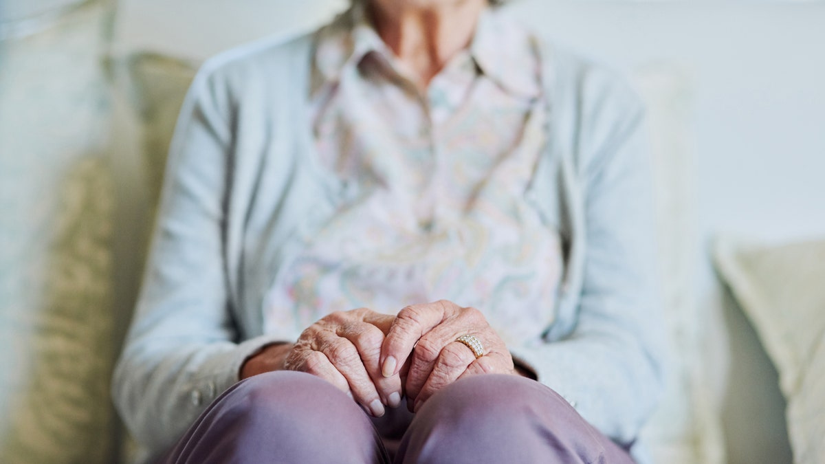 older woman on couch