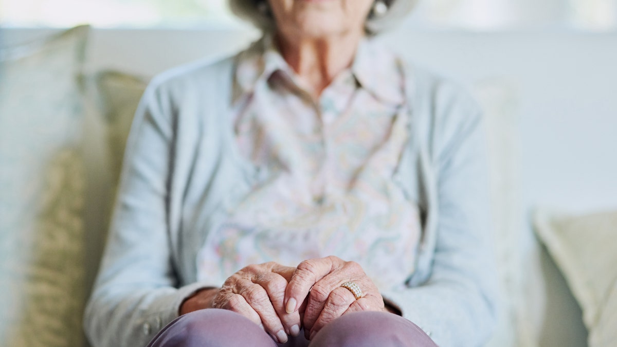 older woman on couch