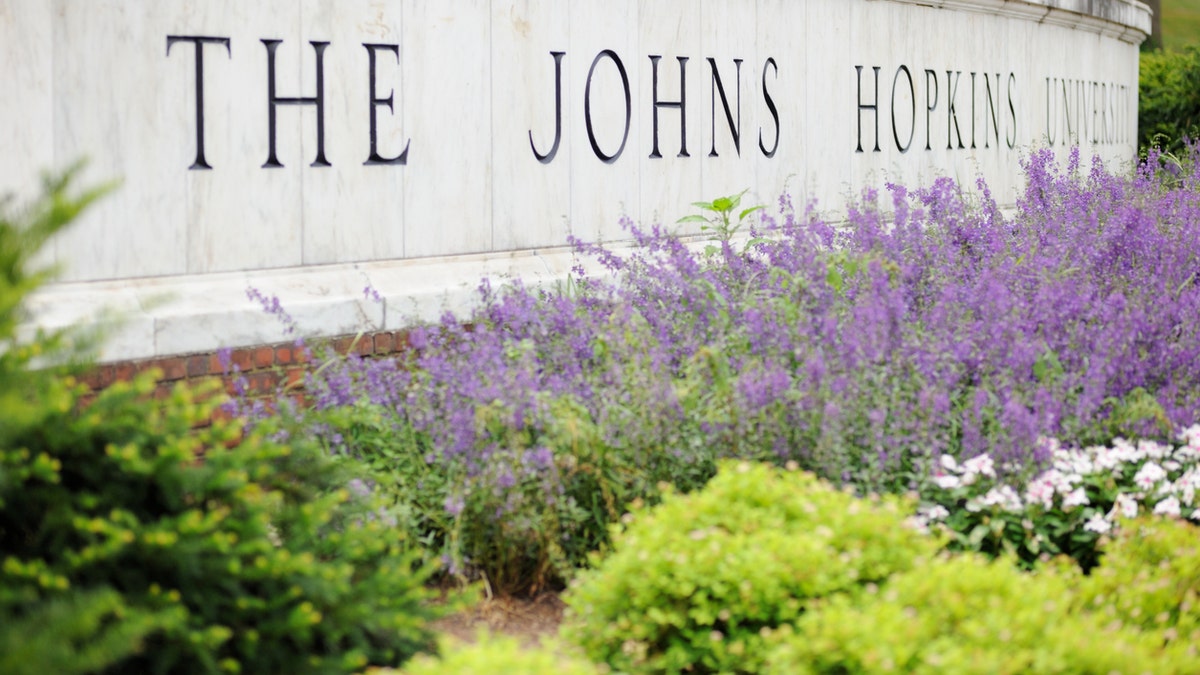 Close up of sign for The Johns Hopkins University in Baltimore, Maryland. On Friday, university officials outlined a series of measures to begin campus life amid a surge in COVID-19 cases.