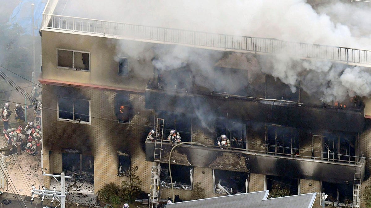 In this July 18, 2019, file photo, firefighters respond to a building fire of Kyoto Animation's No. 1 studio, in Kyoto, western Japan. The fire killed 36 people. (Kyodo News via AP, File)