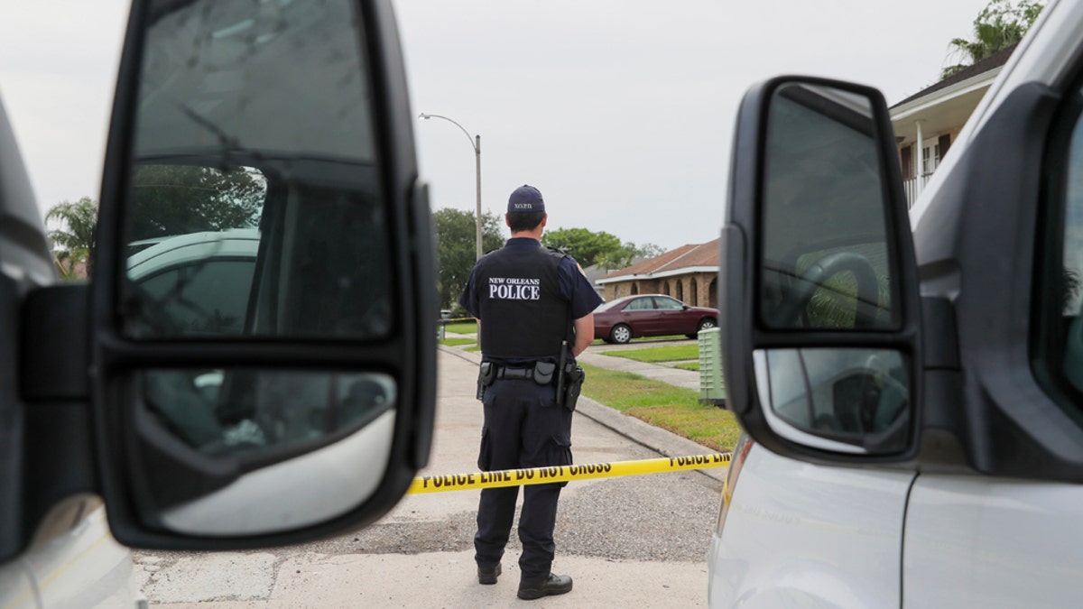 The New Orleans Police Department investigates a double homicide on Arbor Drive in New Orleans East Sunday April 19. (David Grunfeld/The Advocate via AP)