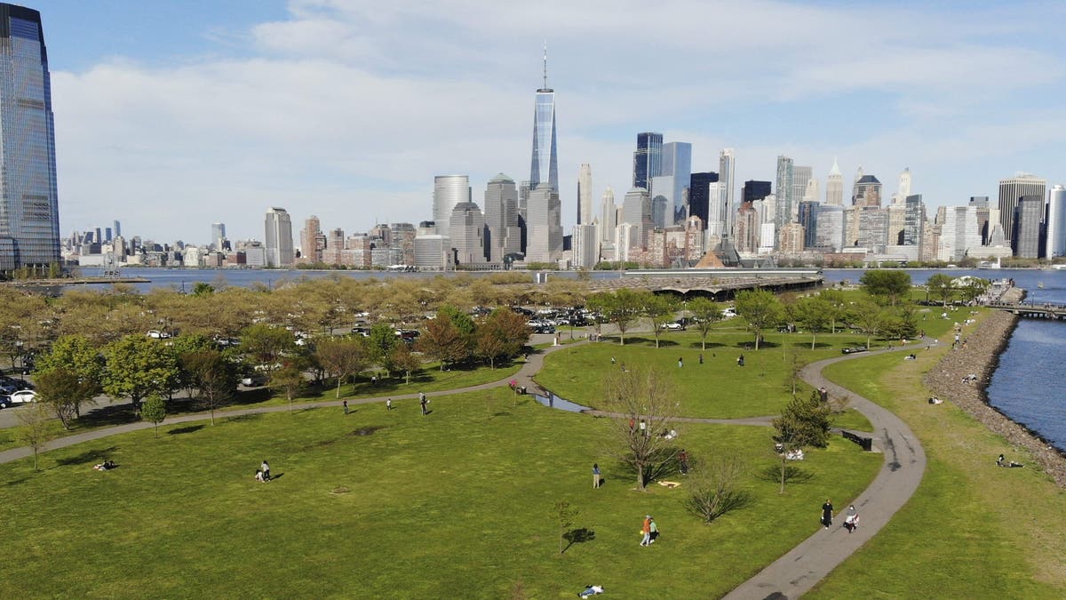 People enjoy the good weather while keeping their distance from one another at Liberty State Park in Jersey City, N.J., on May 2. (AP)